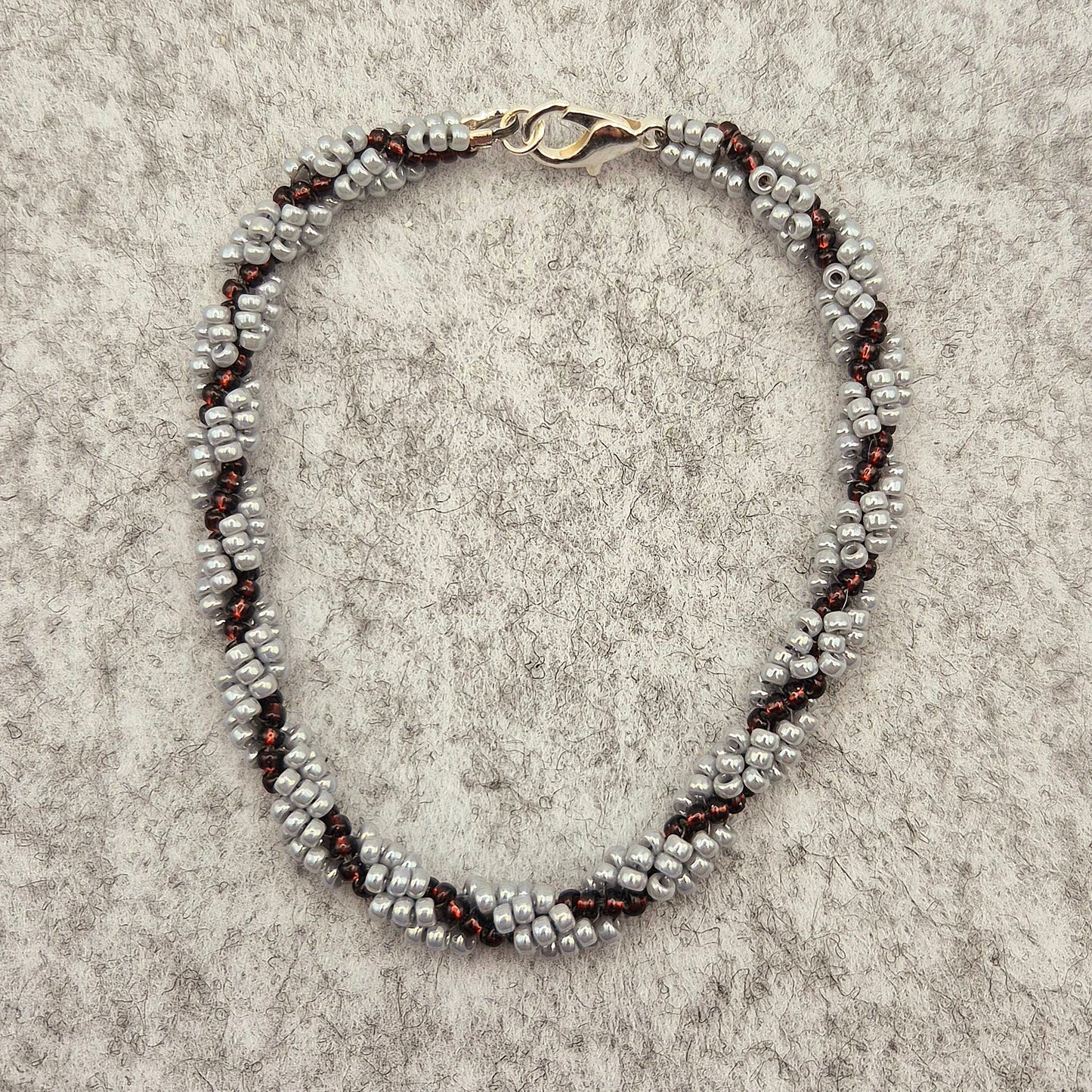 Armkette Spiral in Lila/Silber