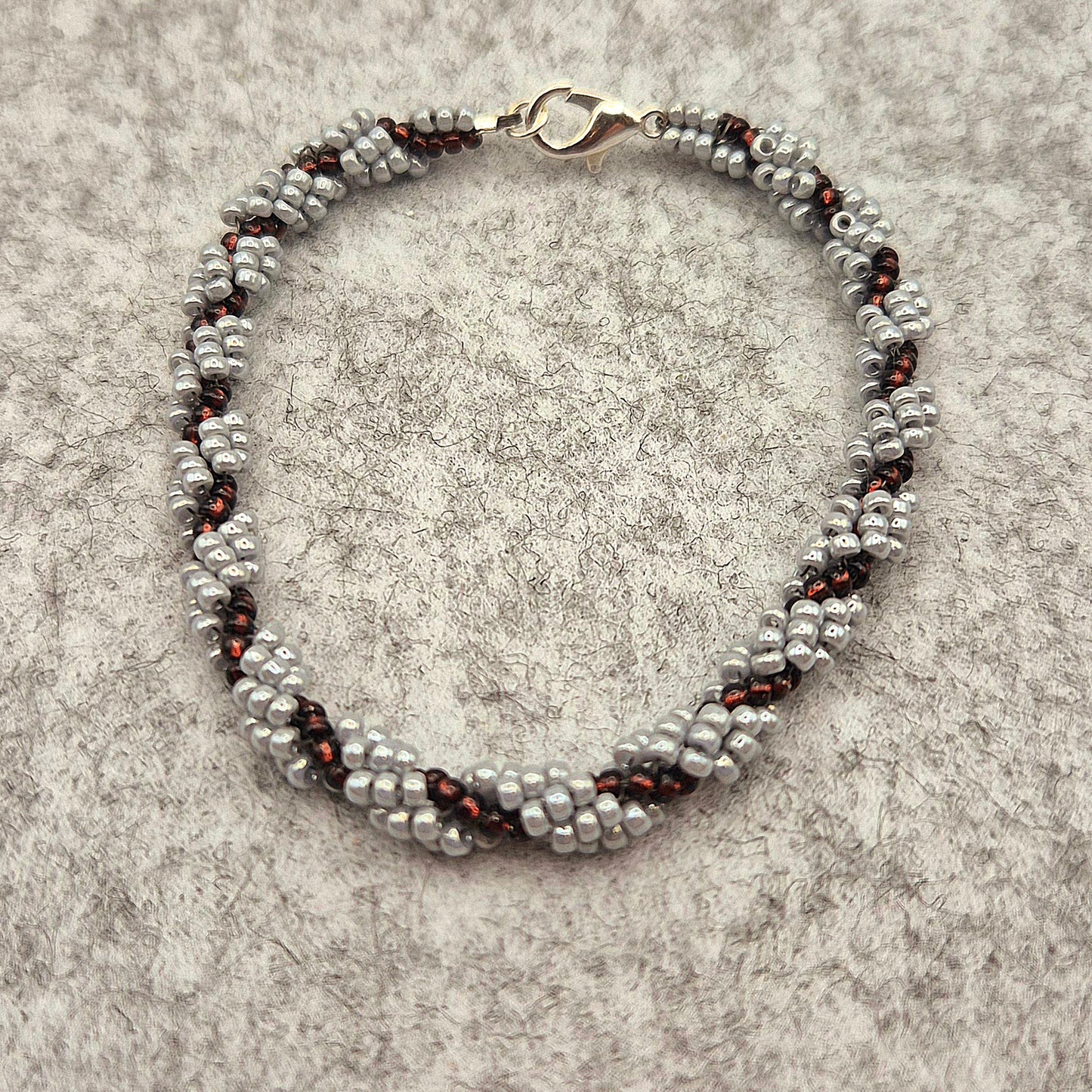 Armkette Spiral in Lila/Silber